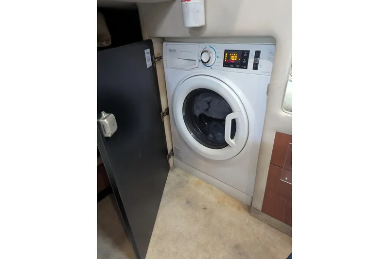 Slide: The Image of Washing machine inside 1998 Sea Ray 480 Sedan Bridge yacht cabin. - 38