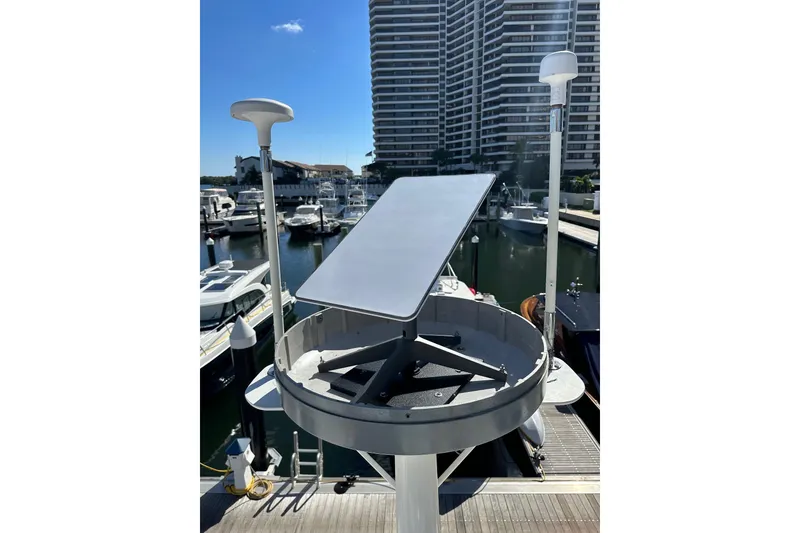 Slide: The Image of 1998 Sea Ray 480 Sedan Bridge with satellite equipment in marina setting. - 42