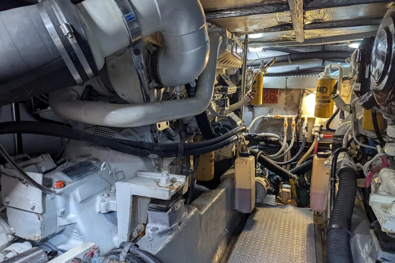 Slide: The Image of Engine room of a 1998 Sea Ray 480 Sedan Bridge yacht, showcasing mechanical components. - 45