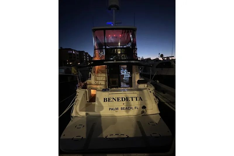 Slide: The Image of 1998 Sea Ray 480 Sedan Bridge yacht docked at night in Palm Beach, FL. - 7
