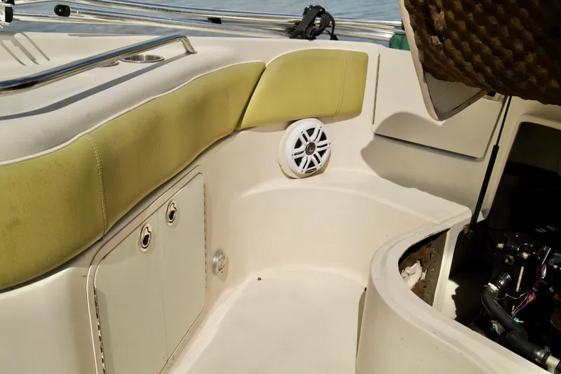 Slide: The Image of Interior of 2005 Sea Ray 240 Bow Rider boat with seating and speaker. - 19