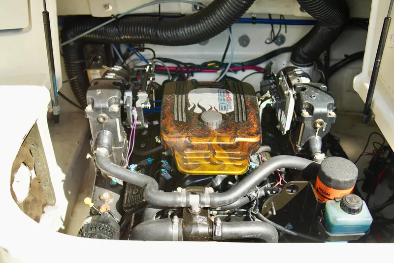 Slide: The Image of Engine compartment of a 2005 Sea Ray 240 Bow Rider boat, showing detailed components. - 20