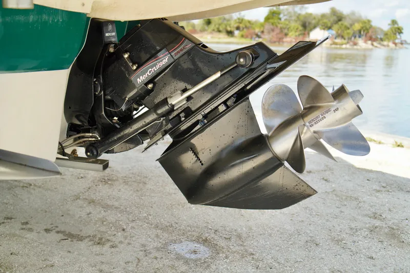 Slide: The Image of 2005 Sea Ray 240 Bow Rider with MerCruiser Bravo Three outdrive, docked by the water. - 22