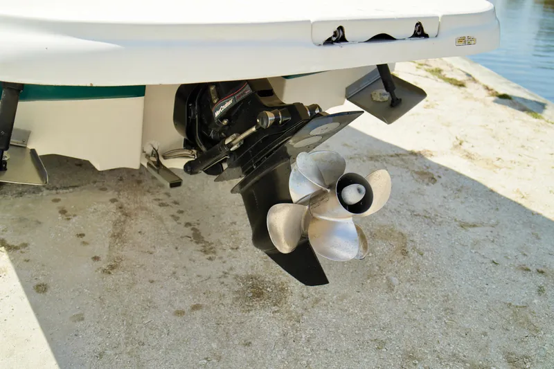 Slide: The Image of Rear view of 2005 Sea Ray 240 Bow Rider boat propeller on concrete surface. - 23