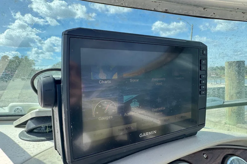Slide: The Image of Garmin navigation system on 2005 Sea Ray 240 Bow Rider boat dashboard. - 9