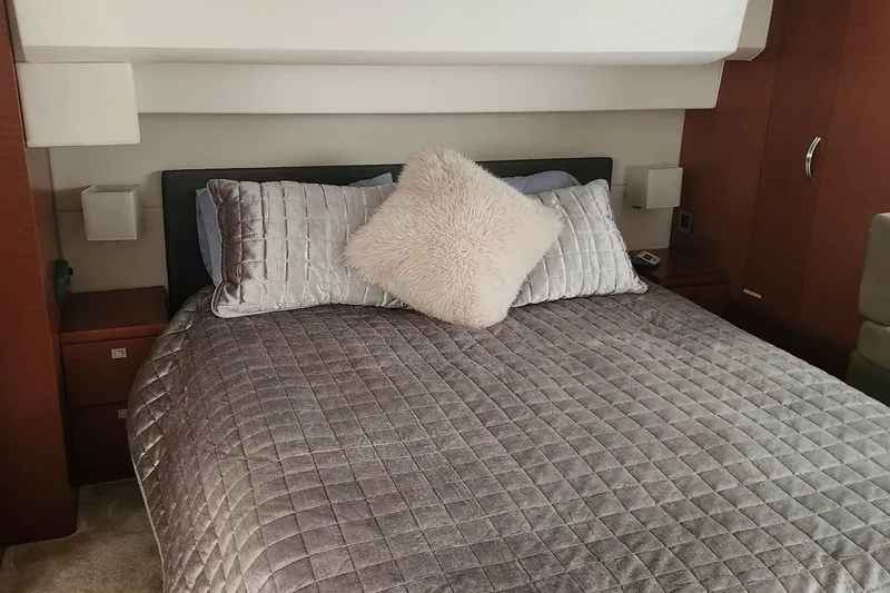 Slide: The Image of Luxurious bedroom interior of 2016 Jeanneau Prestige 50 yacht with plush bedding. - 10