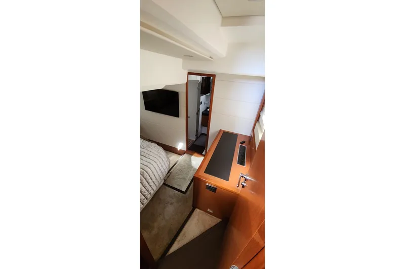 Slide: The Image of Interior of 2016 Jeanneau Prestige 50 yacht, featuring modern design and cozy cabin space. - 11