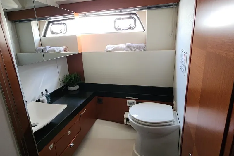 Slide: The Image of Luxurious bathroom in 2016 Jeanneau Prestige 50 yacht with modern fixtures and elegant design. - 13