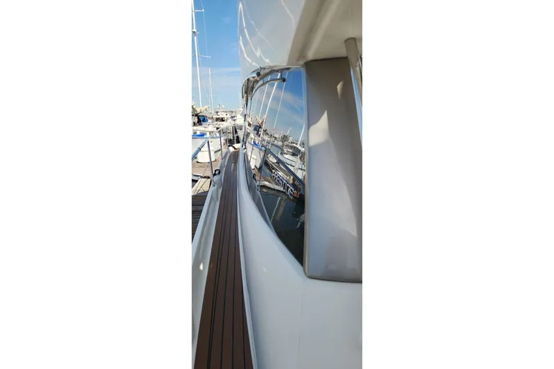 Slide: The Image of 2016 Jeanneau Prestige 50 yacht, side view with marina reflection. - 23