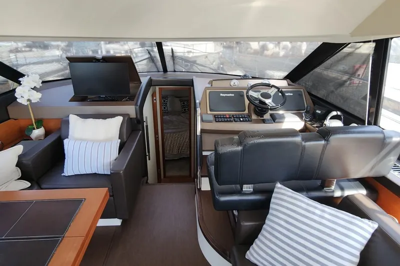 Slide: The Image of Luxurious interior of 2016 Jeanneau Prestige 50 yacht with modern helm and seating area. - 4