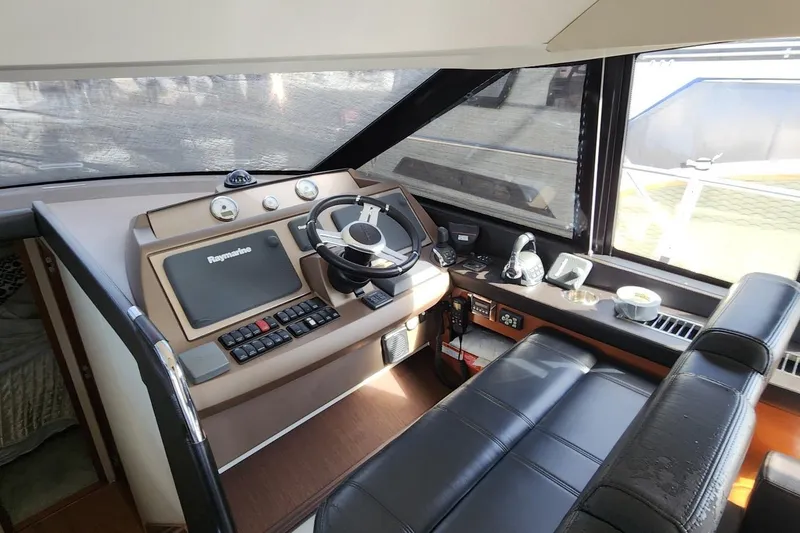Slide: The Image of Helm station of 2016 Jeanneau Prestige 50 yacht with Raymarine navigation system. - 6