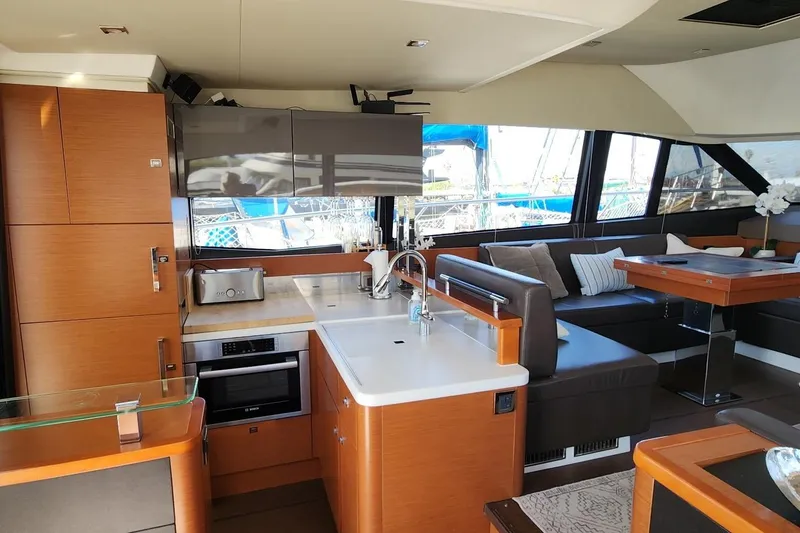 Slide: The Image of Luxurious interior of 2016 Jeanneau Prestige 50 yacht with modern kitchen and seating area. - 8