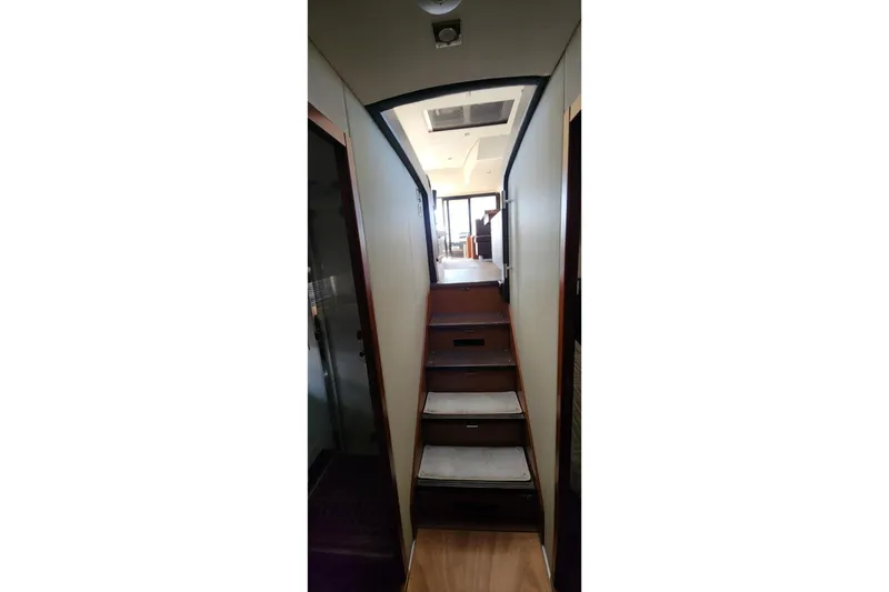 Slide: The Image of Interior staircase of 2016 Jeanneau Prestige 50 yacht, leading to upper deck. - 9