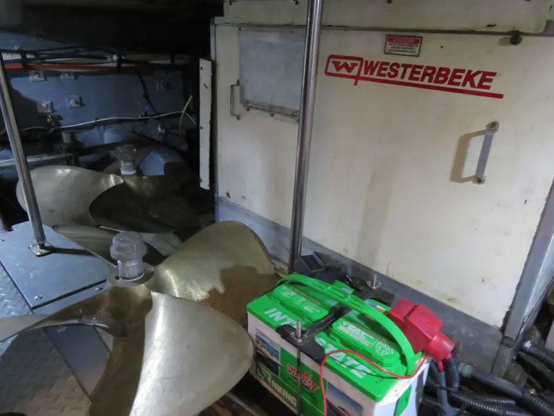 Slide: The Image of Engine room of 1999 Sea Ray 480 DB with Westerbeke generator. - 12