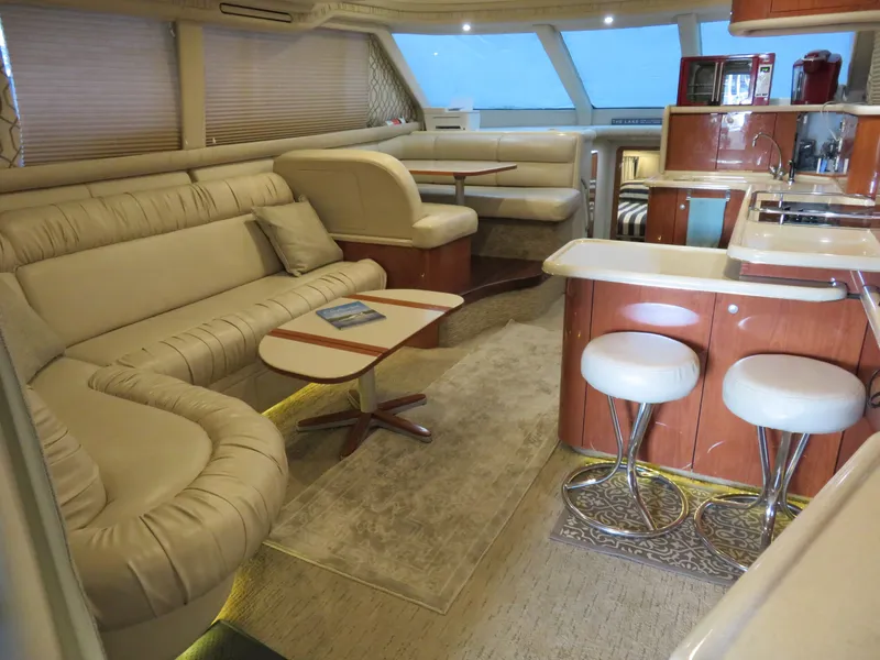 Slide: The Image of Interior of a 1999 Sea Ray 480 DB yacht, luxuriously and comfortably furnished. - 13