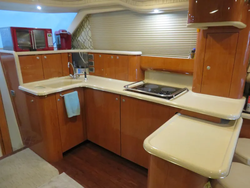Slide: The Image of Interior of 1999 Sea Ray 480 DB yacht kitchen. - 16