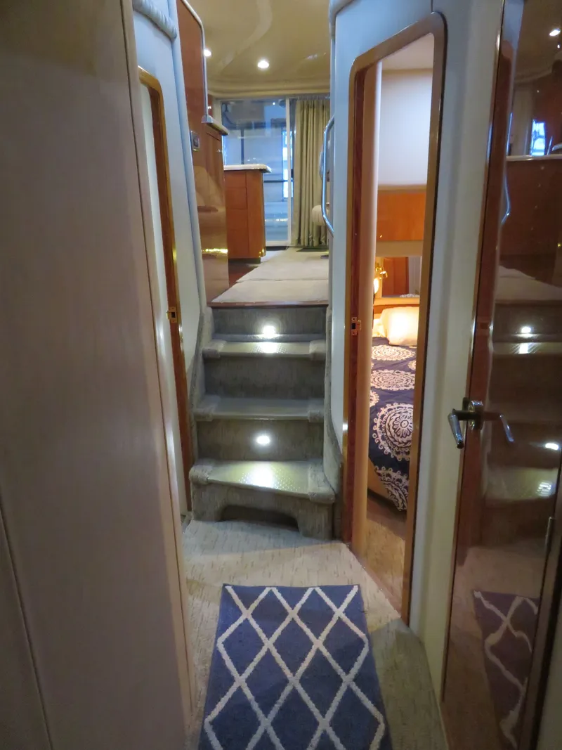 Slide: The Image of Interior of 1999 Sea Ray 480 DB yacht with stairs and cabins. - 22
