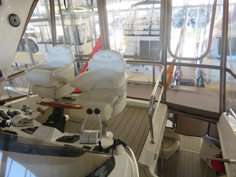 Slide: The Image of Interior of a 1999 Sea Ray 480 DB yacht with helm station. - 6