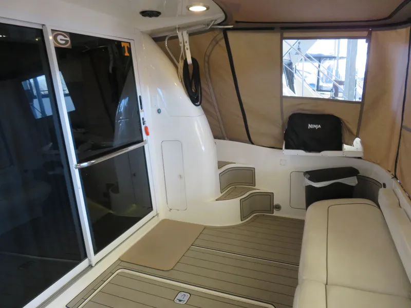 Slide: The Image of Interior of a 1999 Sea Ray 480 DB yacht with beige interior. - 8