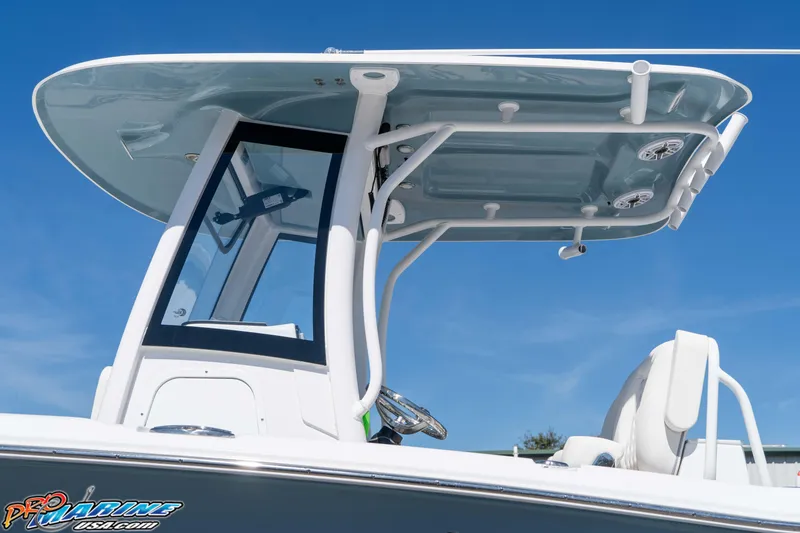 Slide: The Image of 2026 Sea Hunt Ultra 275 SE boat with sleek T-top design against clear blue sky. - 10
