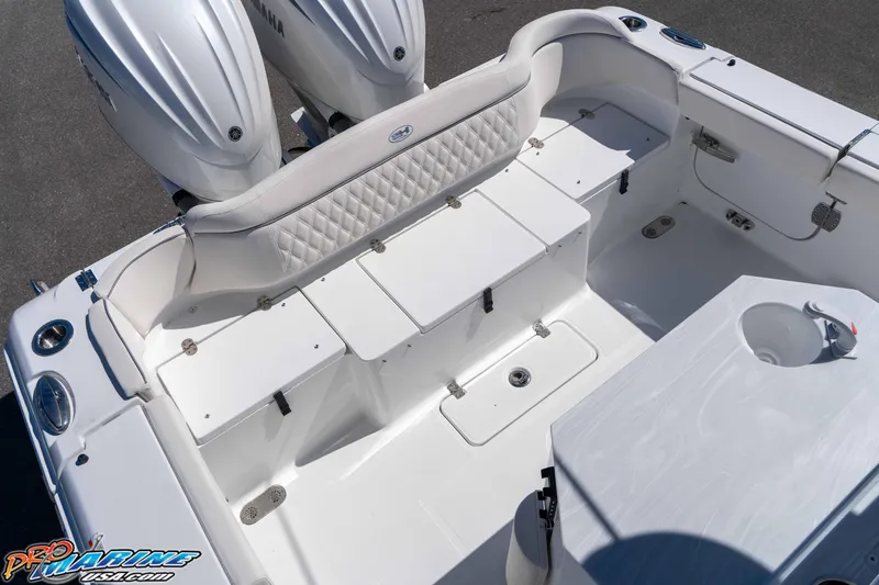 Slide: The Image of 2026 Sea Hunt Ultra 275 SE boat interior with dual Yamaha engines and seating area. - 12