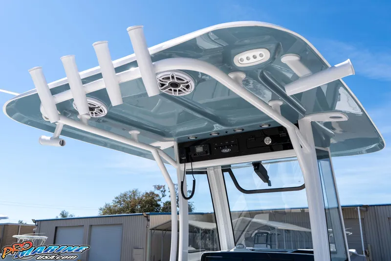 Slide: The Image of 2026 Sea Hunt Ultra 275 SE boat with rod holders and speakers on the T-top. - 15