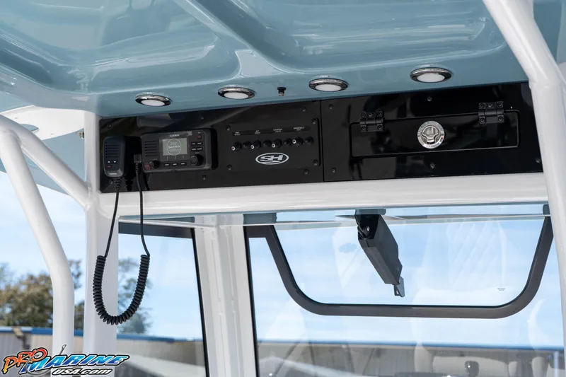Slide: The Image of 2026 Sea Hunt Ultra 275 SE boat console with Garmin radio and sleek design. - 16
