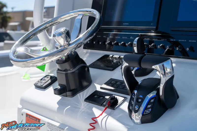 Slide: The Image of Steering console of 2026 Sea Hunt Ultra 275 SE boat with modern controls and displays. - 19