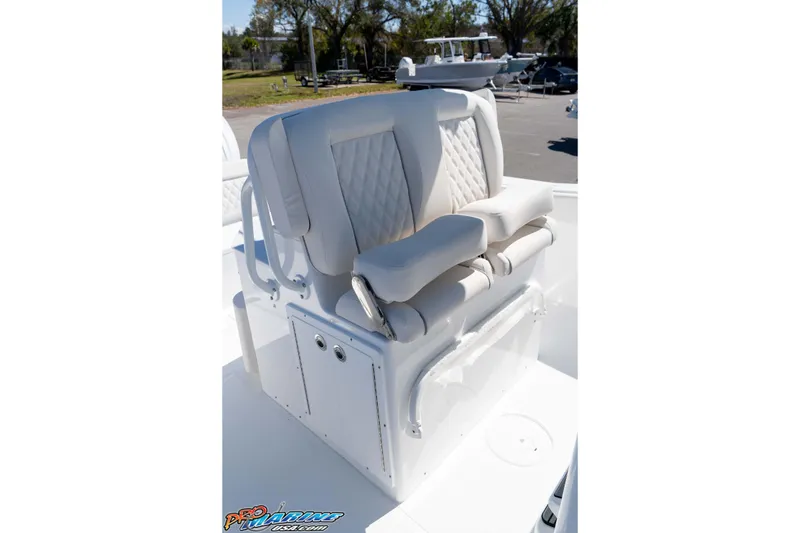 Slide: The Image of 2026 Sea Hunt Ultra 275 SE boat seating with cushioned backrest and armrests. - 20