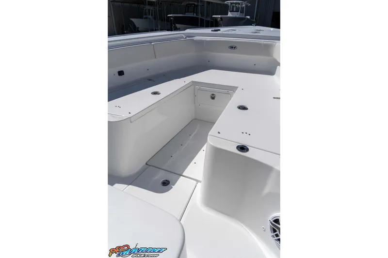 Slide: The Image of 2026 Sea Hunt Ultra 275 SE boat interior, featuring spacious seating and storage compartments. - 24