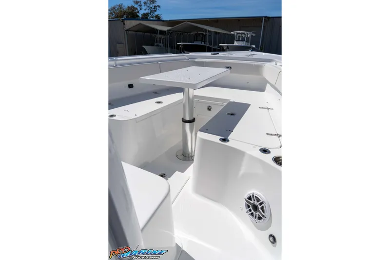 Slide: The Image of 2026 Sea Hunt Ultra 275 SE boat interior with seating and table. - 26