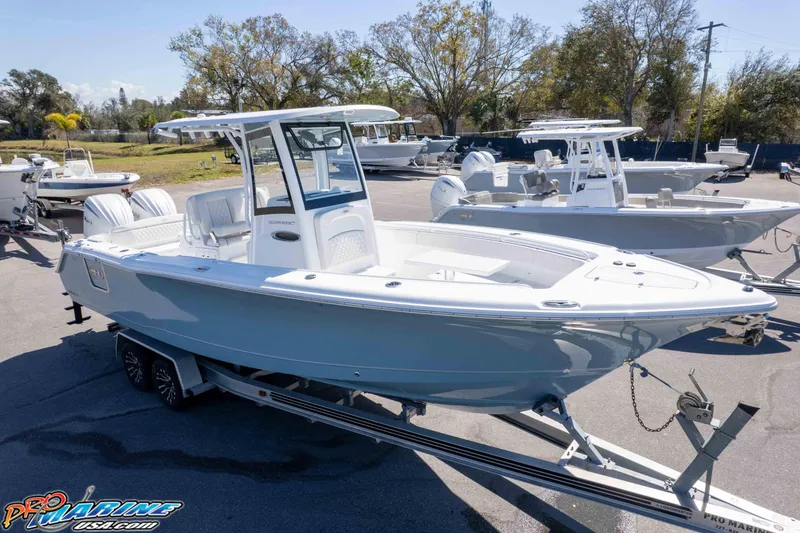 Slide: The Image of 2026 Sea Hunt Ultra 275 SE boat on trailer, displayed outdoors. - 28