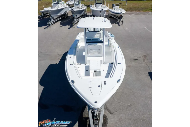Slide: The Image of 2026 Sea Hunt Ultra 275 SE boat displayed in a parking lot, aerial view. - 31