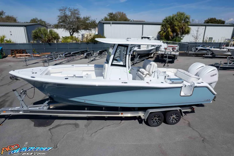 Slide: The Image of 2026 Sea Hunt Ultra 275 SE boat on trailer, featuring sleek design and dual Yamaha engines. - 35