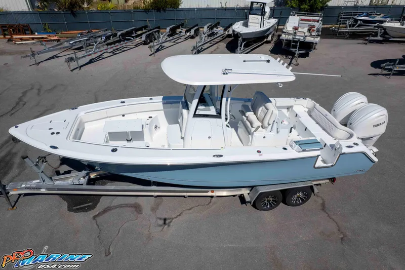 Slide: The Image of 2026 Sea Hunt Ultra 275 SE boat on trailer, featuring dual Yamaha engines. - 36