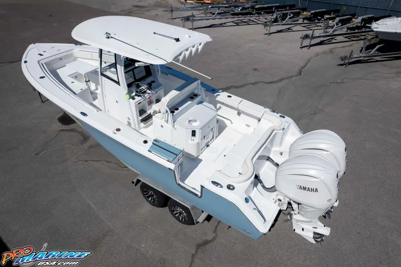 Slide: The Image of 2026 Sea Hunt Ultra 275 SE boat with dual Yamaha engines, parked on a trailer. - 40