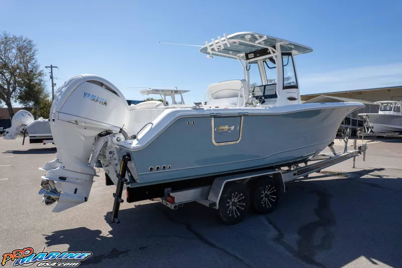 Slide: The Image of 2026 Sea Hunt Ultra 275 SE boat on trailer, featuring Yamaha outboard motor. - 44
