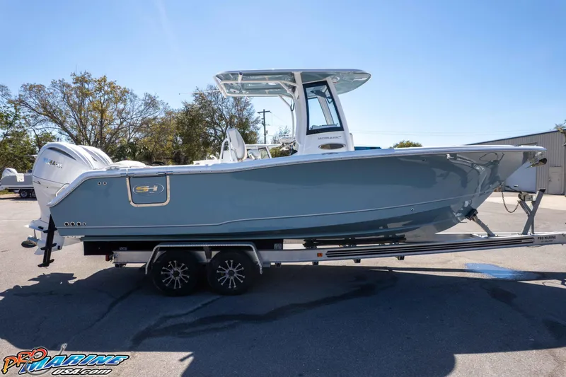 Slide: The Image of 2026 Sea Hunt Ultra 275 SE boat on trailer, parked outdoors. - 47