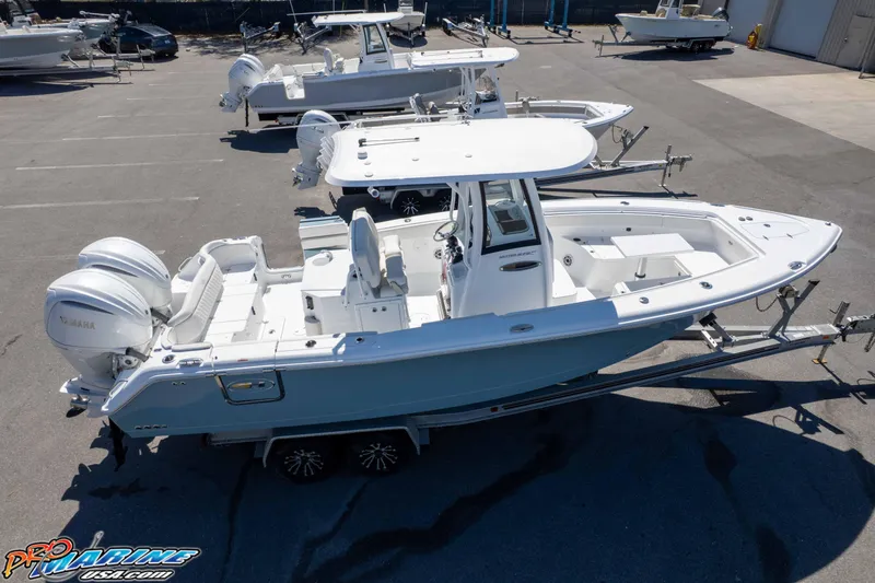 Slide: The Image of 2026 Sea Hunt Ultra 275 SE boat with dual Yamaha engines on trailer. - 49