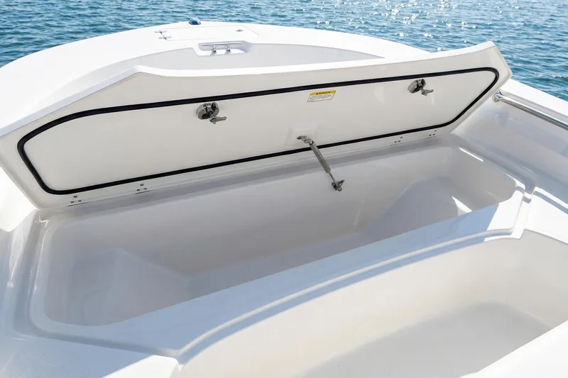 Slide: The Image of 2020 Boston Whaler 190 Montauk boat interior with YETI cooler and fishing rod holders. - 12