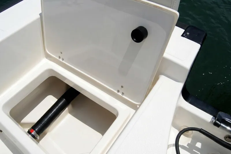 Slide: The Image of 2020 Boston Whaler 190 Montauk boat interior with Mercury engine on blue water. - 17