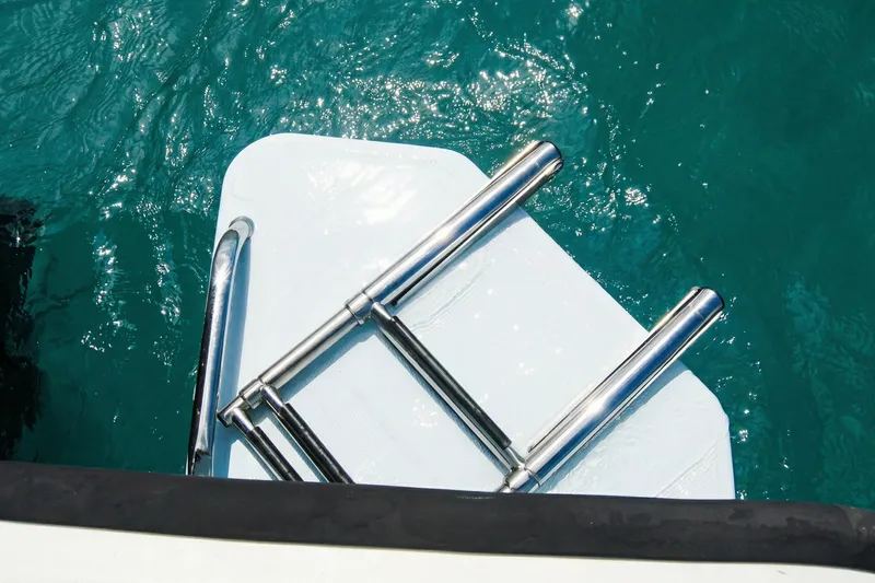 Slide: The Image of 2020 Boston Whaler 190 Montauk boat with powerful outboard motor on water. - 22