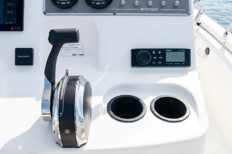 Slide: The Image of Boston Whaler 190 Montauk 2020 boat console with steering wheel and controls. - 5