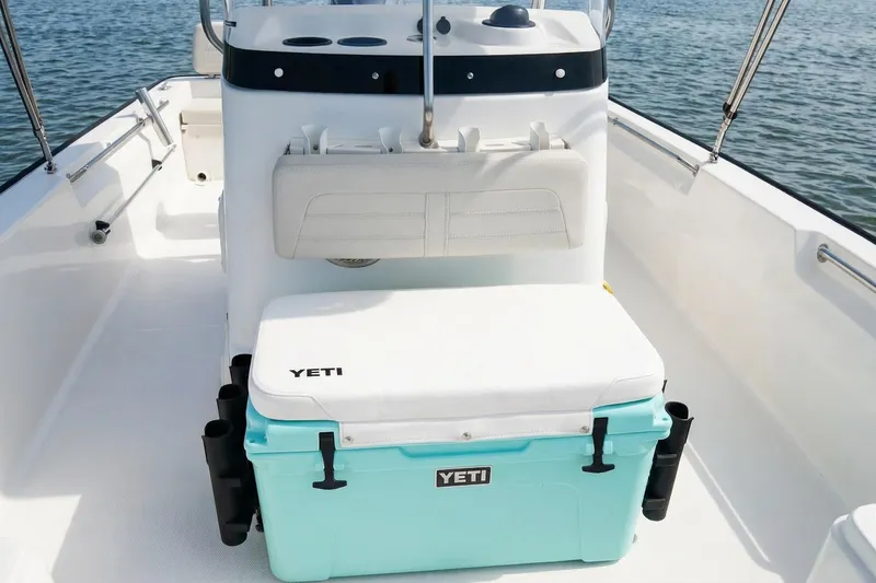 Slide: The Image of Control panel of 2020 Boston Whaler 190 Montauk boat with throttle and cup holders. - 7