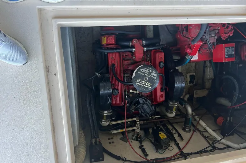 Slide: The Image of Engine compartment of a 1989 Holiday Mansion Super boat, featuring a Volvo Penta engine. - 5