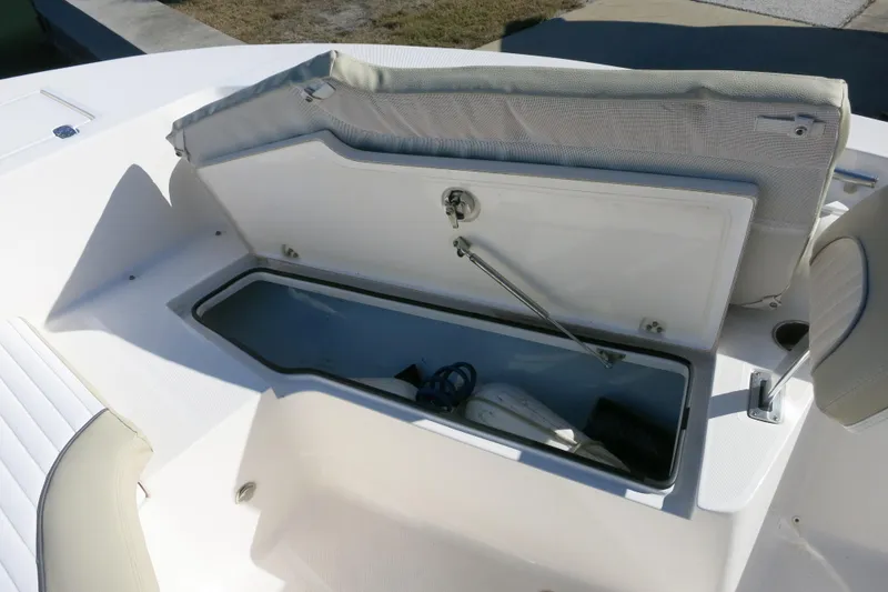 Slide: The Image of 2019 Sea Born LX22 Center Console boat with open storage compartment. - 14