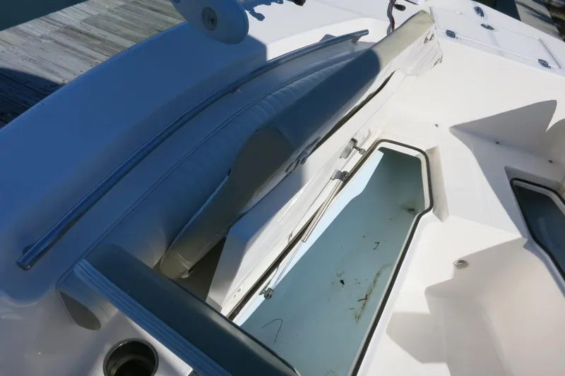 Slide: The Image of 2019 Sea Born LX22 Center Console boat interior with seating and storage compartments. - 15