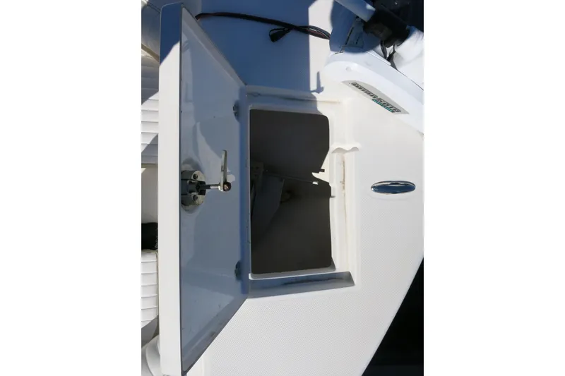 Slide: The Image of Open storage compartment on a 2019 Sea Born LX22 Center Console boat. - 18