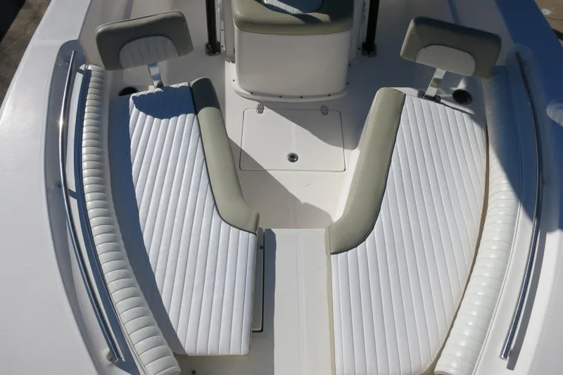 Slide: The Image of 2019 Sea Born LX22 Center Console boat with white cushioned seating. - 19