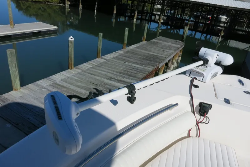 Slide: The Image of 2019 Sea Born LX22 Center Console with trolling motor at dock. - 21